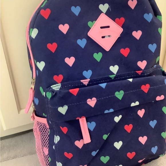 Protege colorful hearts on blue background backpack with pink accents. - Picture 3 of 7